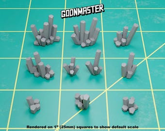 May include: Nine gray, geometric crystal formations are arranged on a green grid. The crystals vary in size and shape, with a mix of tall, slender structures and smaller clusters. The text "GOONMASTER" is at the top, and "Rendered on 1" (25mm) squares to show default scale" is at the bottom.
