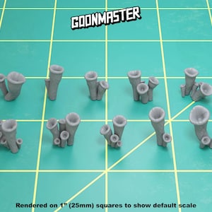 May include: A set of 10 grey 3D printed mushroom models, each with a unique shape and size. The models are arranged on a green grid background.  GOONMASTER is printed in white on the top of the image.