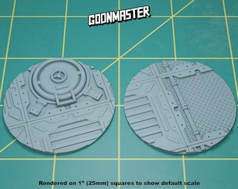 May include: Two gray plastic round bases with different textured designs. One base has a circular hatch in the center. The bases are rendered on 1 inch squares to show default scale.  GOONMASTER is printed in white on a black background.