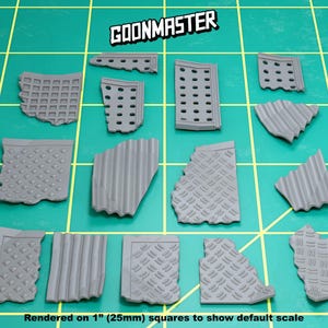 May include: A collection of gray, textured miniature building components, including walls and panels, arranged on a green grid. The text "GOONMASTER" is at the top. The text "Rendered on 1" (25mm) squares to show default scale" is at the bottom.