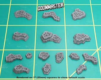 May include: A collection of gray, porous, rock-like miniatures, arranged on a green grid. The text "GOONMASTER" is displayed at the top. The text "Rendered on 1" (25mm) squares to show default scale" is at the bottom.
