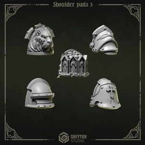 May include: A collection of five gray shoulder pads with various designs. One pad features a lion's head, another has a winged emblem, and a third displays a cross. The text "Shoulder pads 5" is at the top. The GreyTide Studio logo is at the bottom.