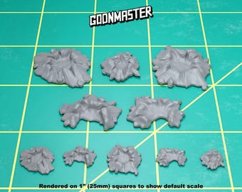 May include: A set of nine grey plastic crater terrain pieces, rendered on 1" (25mm) squares to show default scale.  The craters range in size and shape, with some having a more defined rim than others.