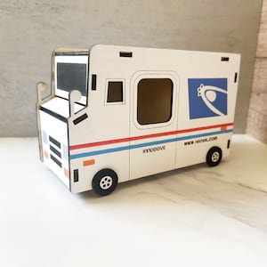 May include: A white toy mail truck with blue and red stripes, a blue logo with a stylised bird, and the text "www.hmail.com" and "innoDOVE".