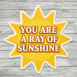 You Are a Ray of Sunshine Sticker – Positive Affirmation Vinyl Decal, Motivational Sunshine Quote, Cute Yellow Sun Shape Sticker for Laptop