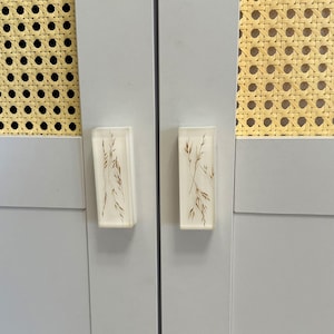 Add a charming touch to your cabinets and furniture with our handcrafted rustic green drawer knobs and oat drawer pulls. These unique pieces will enhance the look of any space, bringing a natural and organic feel to your home decor.