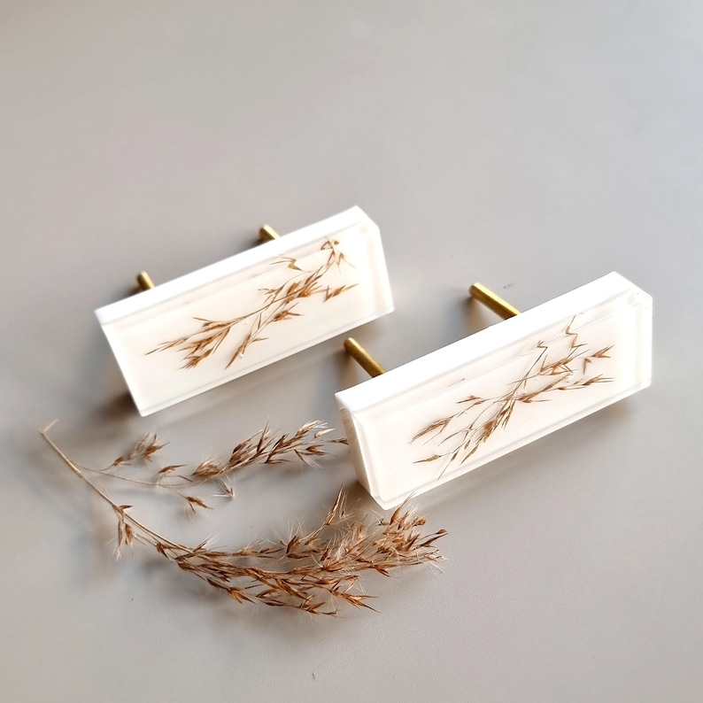 Add a charming touch to your cabinets and furniture with our handcrafted rustic green drawer knobs and oat drawer pulls. These unique pieces will enhance the look of any space, bringing a natural and organic feel to your home decor.