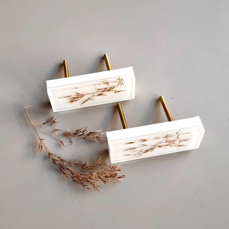 Add a charming touch to your cabinets and furniture with our handcrafted rustic green drawer knobs and oat drawer pulls. These unique pieces will enhance the look of any space, bringing a natural and organic feel to your home decor.