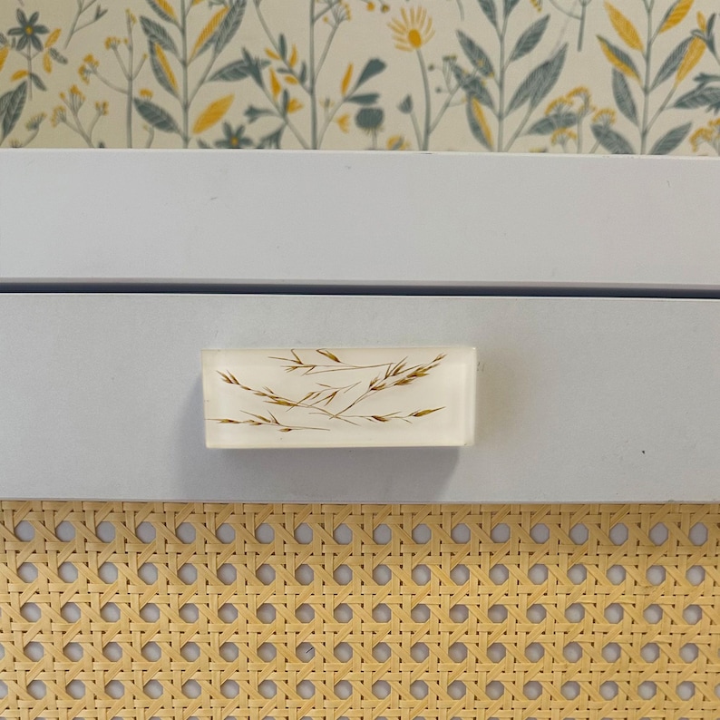 Add a charming touch to your cabinets and furniture with our handcrafted rustic green drawer knobs and oat drawer pulls. These unique pieces will enhance the look of any space, bringing a natural and organic feel to your home decor.