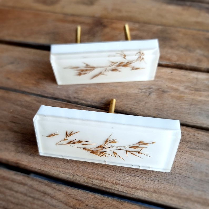 Add a charming touch to your cabinets and furniture with our handcrafted rustic green drawer knobs and oat drawer pulls. These unique pieces will enhance the look of any space, bringing a natural and organic feel to your home decor.