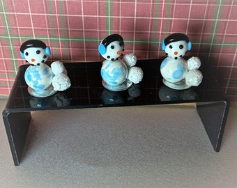 Miniature Snowman with snowballs