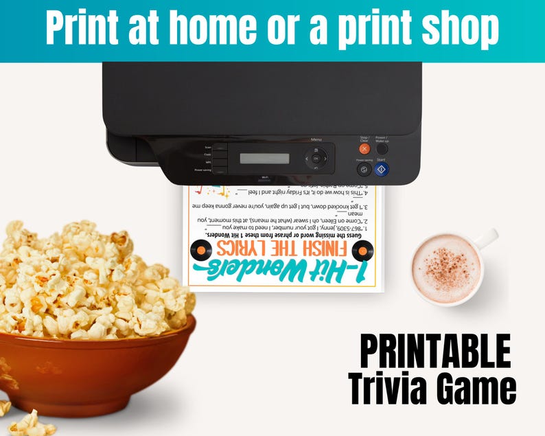 May include: A black printer feeding a white sheet of paper with a 1-Hit Wonders Finish the Lyrics trivia game printed on it, positioned next to a brown bowl filled with popcorn and a white mug containing a light brown beverage.