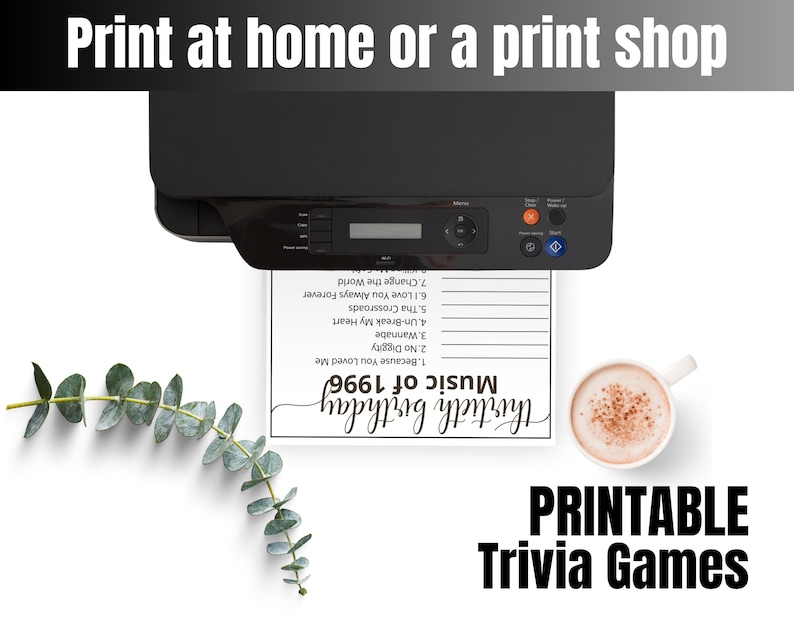 May include: A black printer outputting a white sheet of paper with the text Music of 1996 and Thirtieth Birthday, featuring a list of song titles. Beside the paper is a white mug filled with a light brown beverage and a green eucalyptus branch.