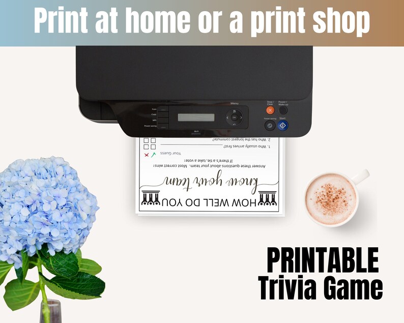 May include: A black printer outputting a white sheet of paper with the text "HOW WELL DO YOU know your team" and trivia questions. To the left is a blue hydrangea flower, and to the right is a white mug filled with a light brown beverage.