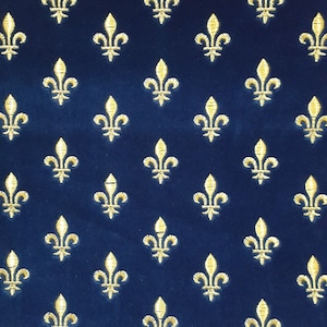 May include: A navy blue fabric with a repeating pattern of gold fleurs-de-lis.