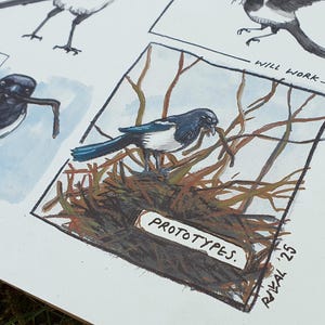May include: A black and white magpie perched on a branch with a twig in its beak. The bird is in a watercolor illustration style. The text "PROTOTYPES" is written on a sign below the bird.
