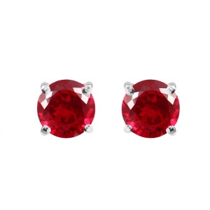 May include: A pair of silver stud earrings with round red gemstones.