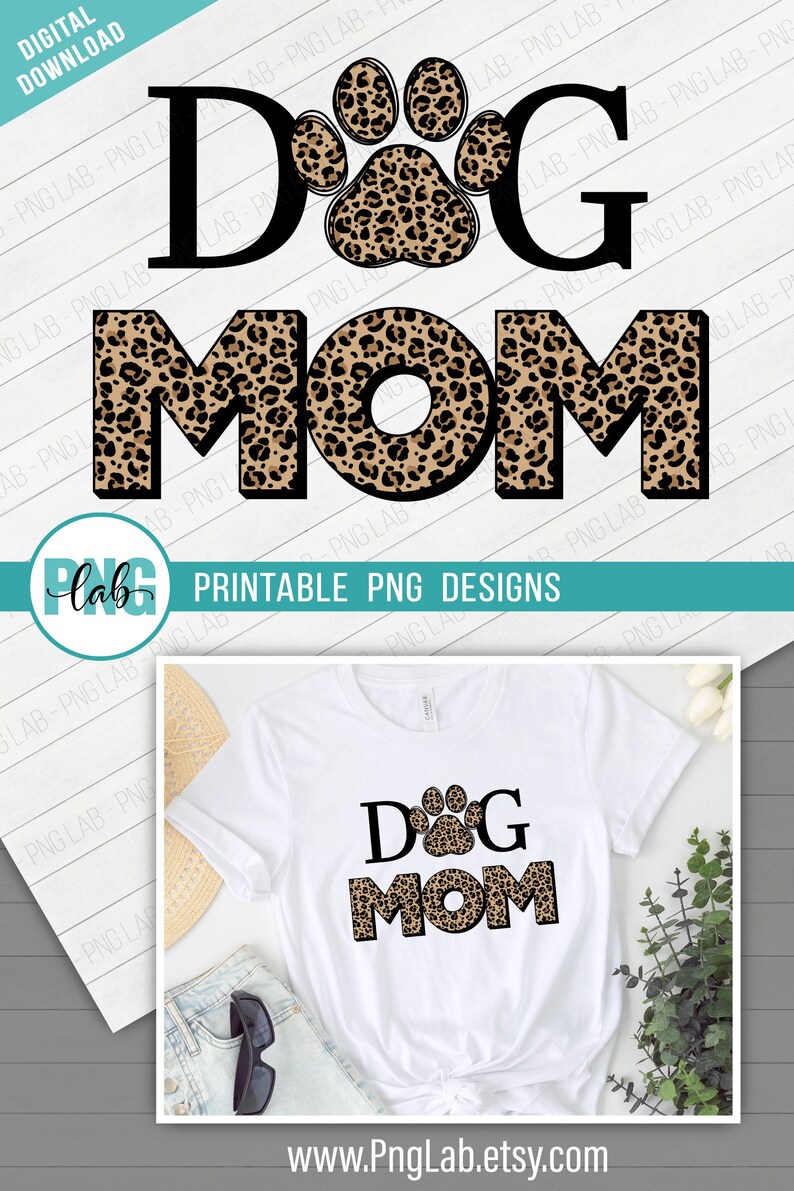 以下が含まれることがあります： 「DOG MOM」という文字の黒いアウトラインが描かれた白いTシャツ。 「O」の真ん中にヒョウ柄の足跡があります。