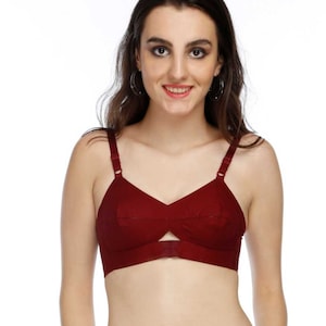 May include: A maroon-colored bra with adjustable straps and a front closure. The bra has a smooth, seamless design and a slightly padded cup.