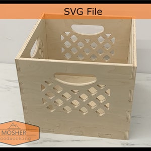 May include: A wooden crate with a diamond-shaped lattice pattern on the front and sides. The crate has two handles on the sides and is made of light-coloured wood.