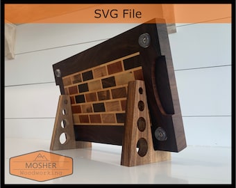 May include: A wooden cutting board with a brick pattern inlay, featuring a handle and a stand. The board is made of walnut and maple wood and has a dark brown finish. The stand is made of the same wood and has a natural finish. The board is labeled "MOSHER Woodworking".