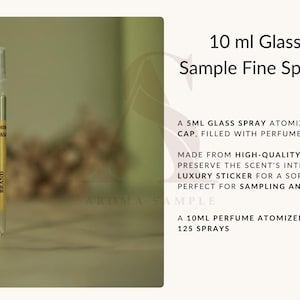May include: A 10 ml glass perfume sample fine spray atomizer. The clear glass bottle has a gold label with the brand name. The text on the label reads "NAME BRAND". The atomizer is designed for sampling and travel.