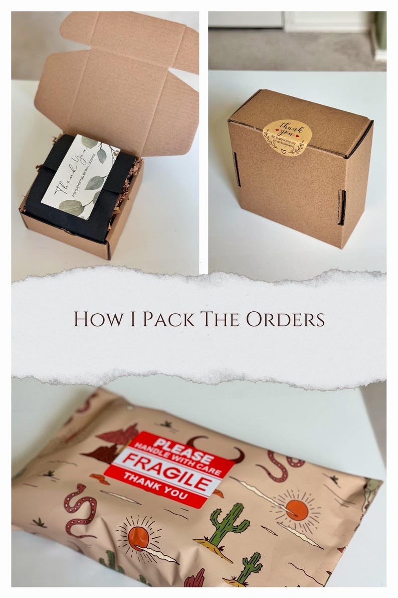 K&ouml;nnte beinhalten: Nahaufnahme einer braunen Pappbox mit einem Dankesch&ouml;n-Aufkleber. Die Box ist ge&ouml;ffnet und mit schwarzem Seidenpapier gef&uuml;llt. Die Box steht auf einer wei&szlig;en Oberfl&auml;che. Der Text auf dem Aufkleber lautet "Danke".