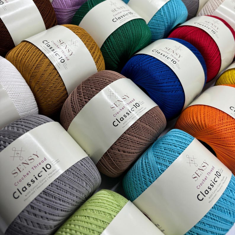 May include: A variety of colorful yarn balls with the label "SENSY Crochet Thread Classic 10" on each ball.