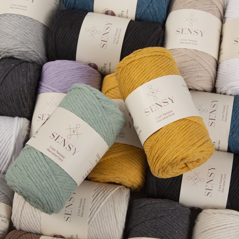 May include: A variety of colors of 3mm and 5mm twisted macrame cord. The cord is made of cotton and is available in a variety of colors, including natural, green, yellow, and black. The cord is packaged in a clear plastic bag with a label that says "SENSY 3mm Twisted Macrame Cord".