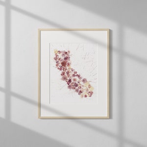 May include: A framed watercolor painting of a stylized outline of the state of California, filled with pink and purple watercolor dots.