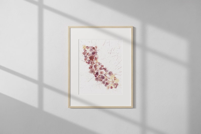 May include: A framed watercolor painting of a stylized outline of the state of California, filled with pink and purple watercolor dots.