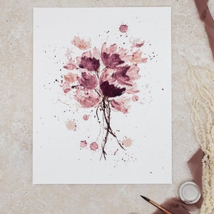 May include: A watercolor painting of a bouquet of pink flowers with brown stems and splatters of pink paint on a white background.