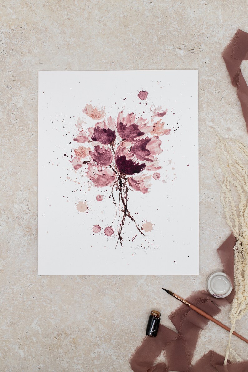 May include: A watercolor painting of a bouquet of pink flowers with brown stems and splatters of pink paint on a white background.