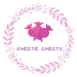 May include: A pink and white floral wreath with the text "Sweetie Sweets" in purple lettering.  The centre of the wreath features three pink and white candy pieces.