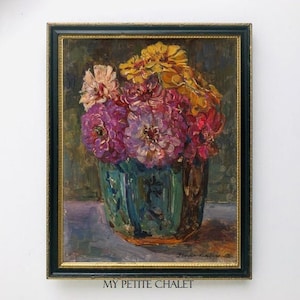 May include: A framed oil painting of a bouquet of pink, purple, and yellow flowers in a blue and green vase. The flowers are arranged in a vase with a floral pattern. The painting is set against a dark brown background.