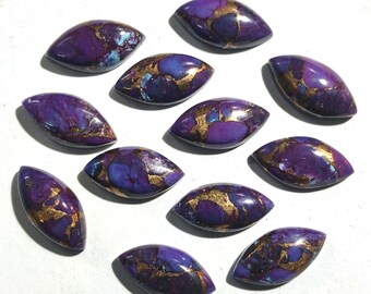May include: Twelve purple and gold cabochon stones with a marbled pattern. The stones are oval shaped and have a smooth, polished finish.