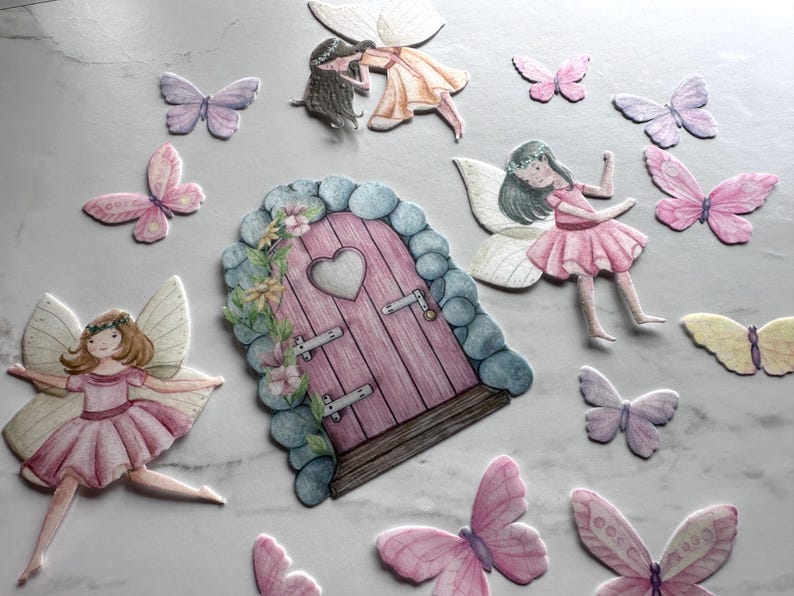May include: A set of fairy door and butterfly decorations. The door is pink with a heart-shaped window and is surrounded by green vines and flowers. The butterflies are in various shades of pink, purple, and yellow.