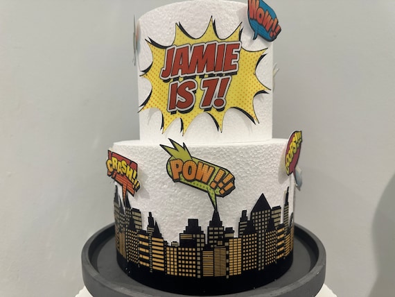 Precut edible comic book buildings / skyscrapers - superhero Birthday theme cake toppers set with speech bubbles - Kapow Boom Pow Oops Crash