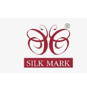 May include: A green circle with a wreath of leaves and the text "100% Organic". A red heart in two hands with the text "Cruelty Free". A white rectangle with a butterfly logo and the text "SILK MARK". A gray rectangle with a loom icon and the text "HANDLOOM". A green circle with a white leaf and the text "Environmental Friendly".