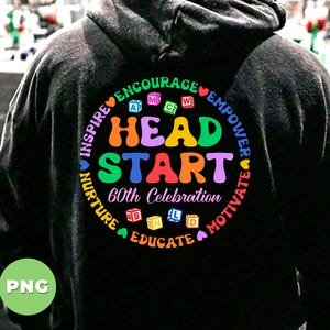 May include: Black hoodie with a colorful graphic that says "Head Start 60th Celebration" surrounded by the words "Inspire, Nurture, Educate, Motivate, Encourage, Empower".