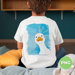 May include: A white t-shirt with a blue watercolor background and a white goose with a yellow beak and orange eyes looking over its shoulder. The goose has question marks above its head. The t-shirt is being worn by a person.