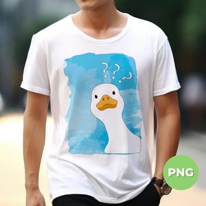 May include: White t-shirt with a blue watercolor background and a white goose with a yellow beak and orange feet. The goose is looking at the viewer with a confused expression. The words '???' are written above the goose.