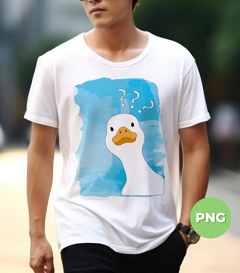 May include: White t-shirt with a blue watercolor background and a white goose with a yellow beak and orange feet. The goose is looking at the viewer with a confused expression. The words '???' are written above the goose.