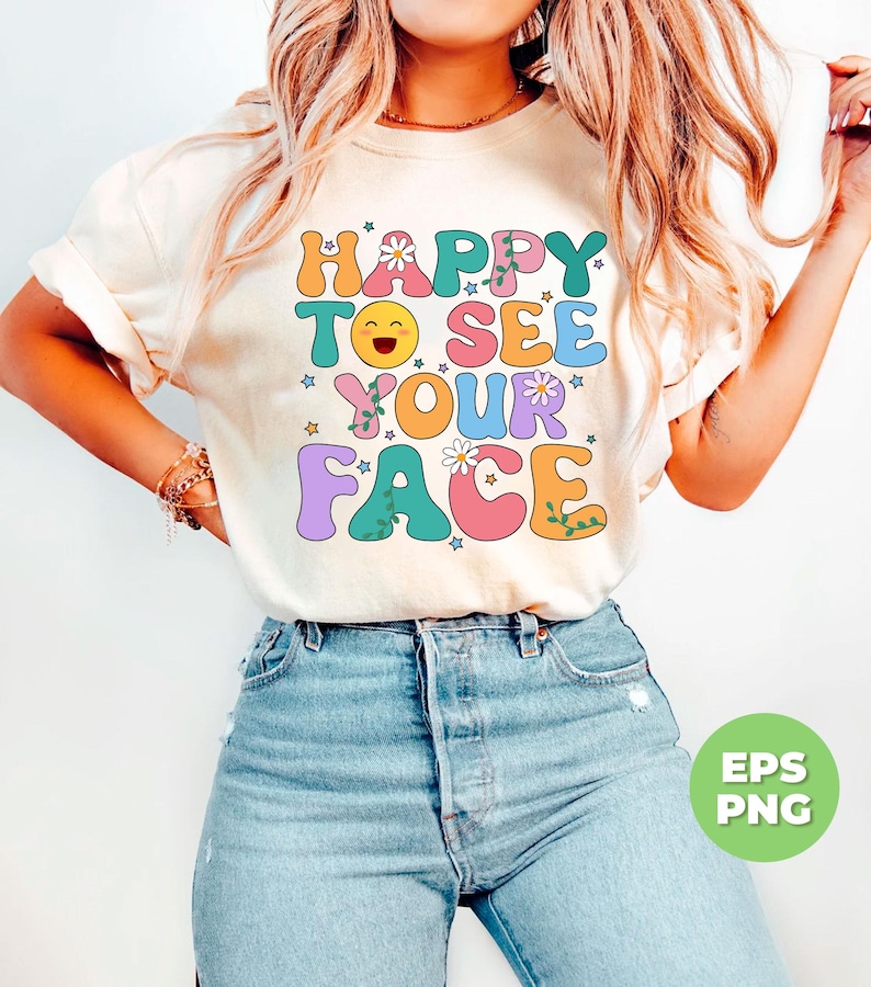 May include: A white t-shirt with the text "HAPPY TO SEE YOUR FACE" in colorful, outlined letters with flowers and stars.
