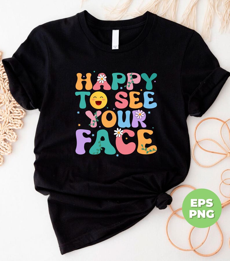 May include: Black t-shirt with a colorful graphic that says "Happy to see your face" with a smiley face and flowers.