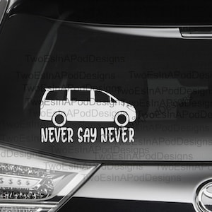 May include: White vinyl decal of a minivan with the text "NEVER SAY NEVER" below it. The decal is on the back window of a black car.