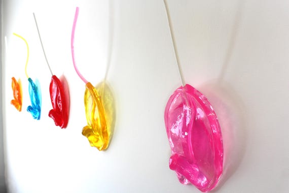 Resin sucker melting down the wall art sculpture 21 inches tall pink your color find out more.