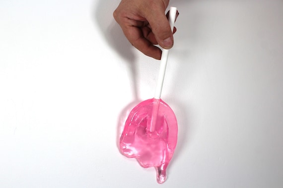 Wall hanging resin candy melting sucker sculpture hot pink 11 inches long find out more.