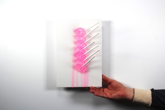 Fractal resin suckers melting down the wall 3D art.  Colorful fun wall art.