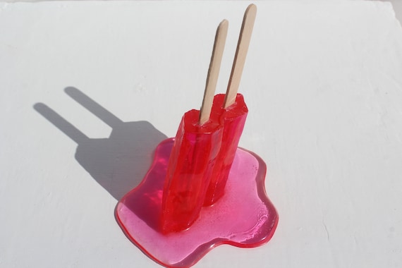 Resin twin popsicle double stick melting sucker sculptures, bright red, find out more.